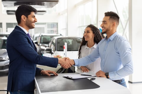 Auto dealer closing a deal