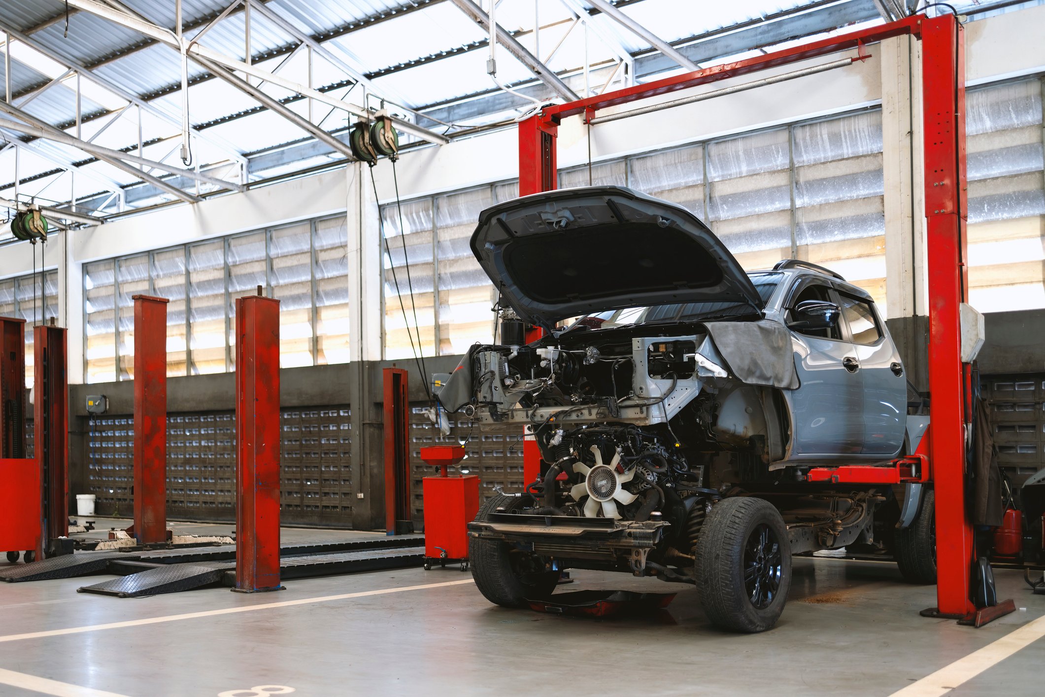 a truck being worked on at a collision center