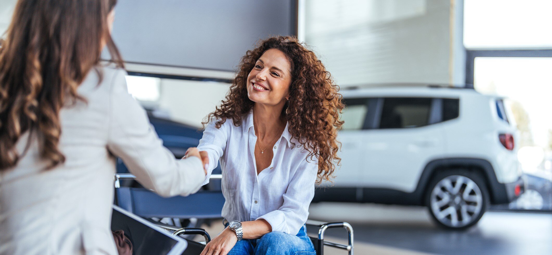 making a deal at an auto dealership