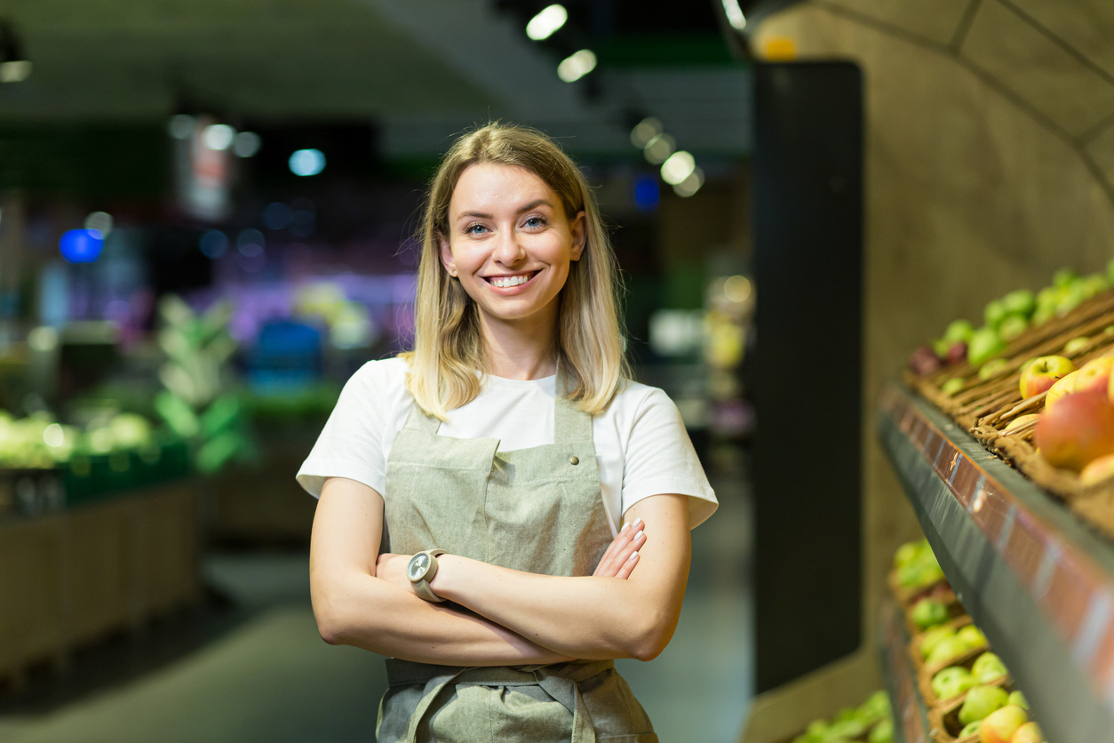 grocery store owner standing in her store